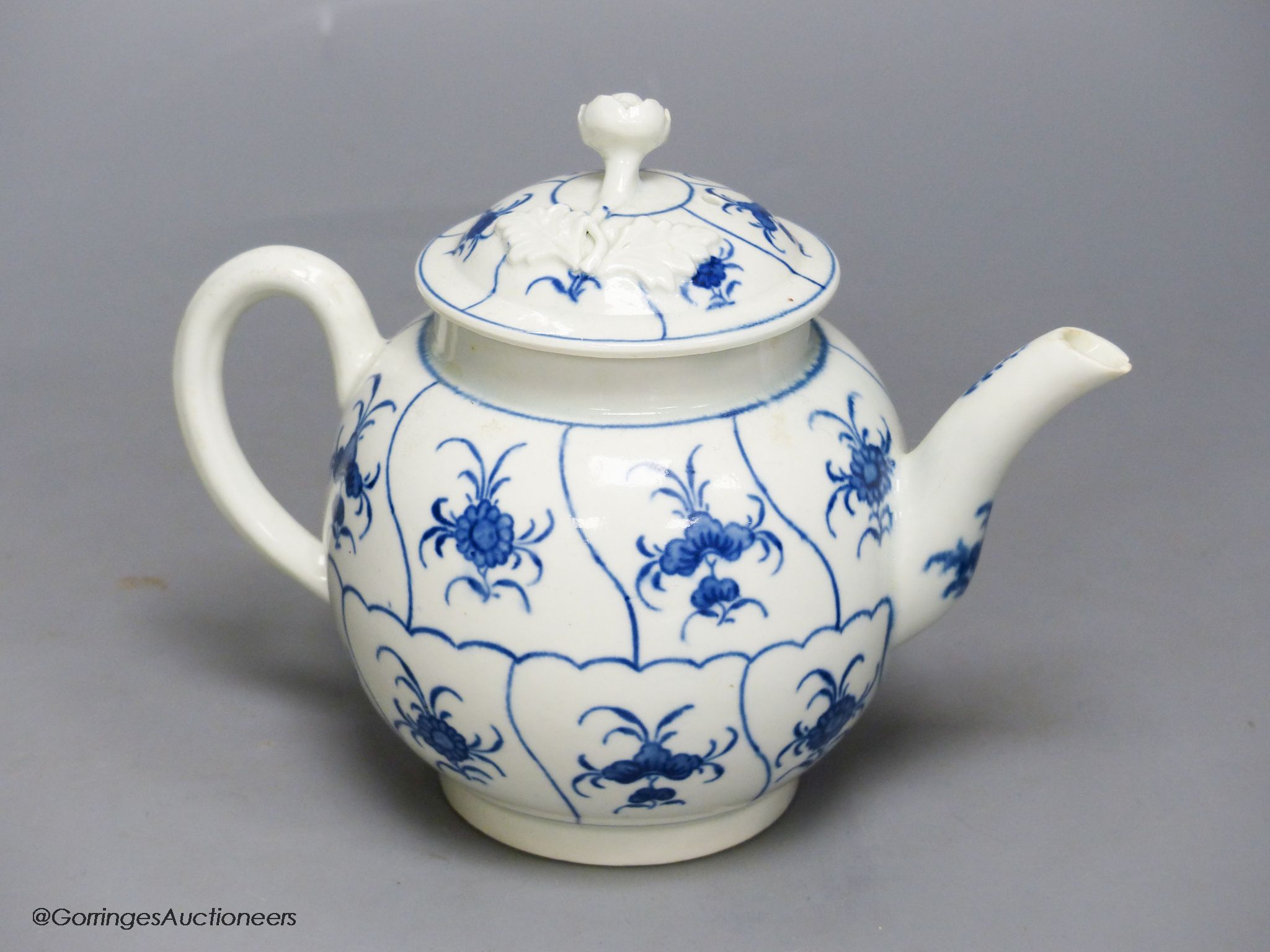 An 18th century Worcester blue and white teapot, height 14cm